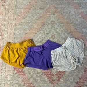 Lululemon Hotty Hot 2.5 shorts in LSU gold, purple, and cream stripes 3 pack